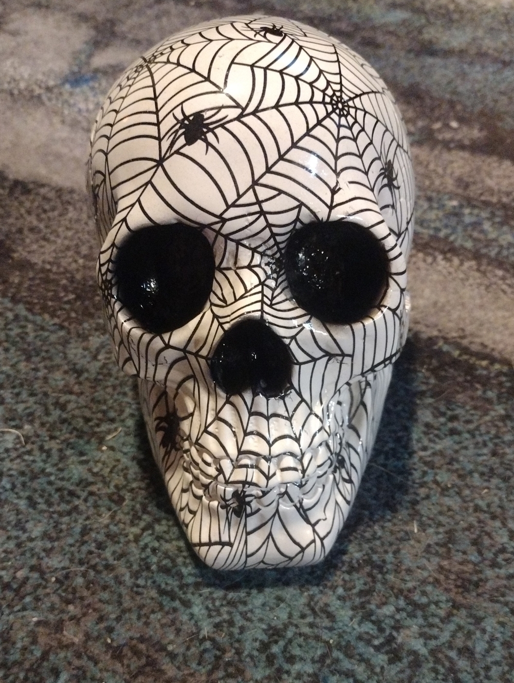 Ceramic Skull with Black Spiderweb Design